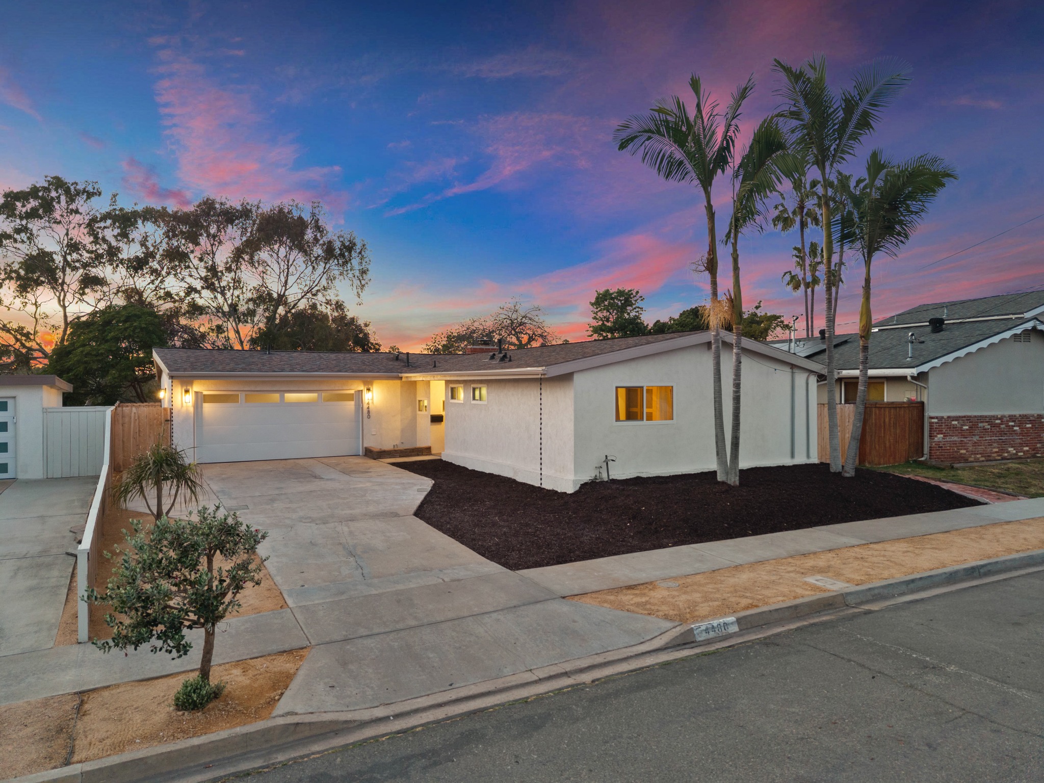 Completed home exterior remodel at sunset